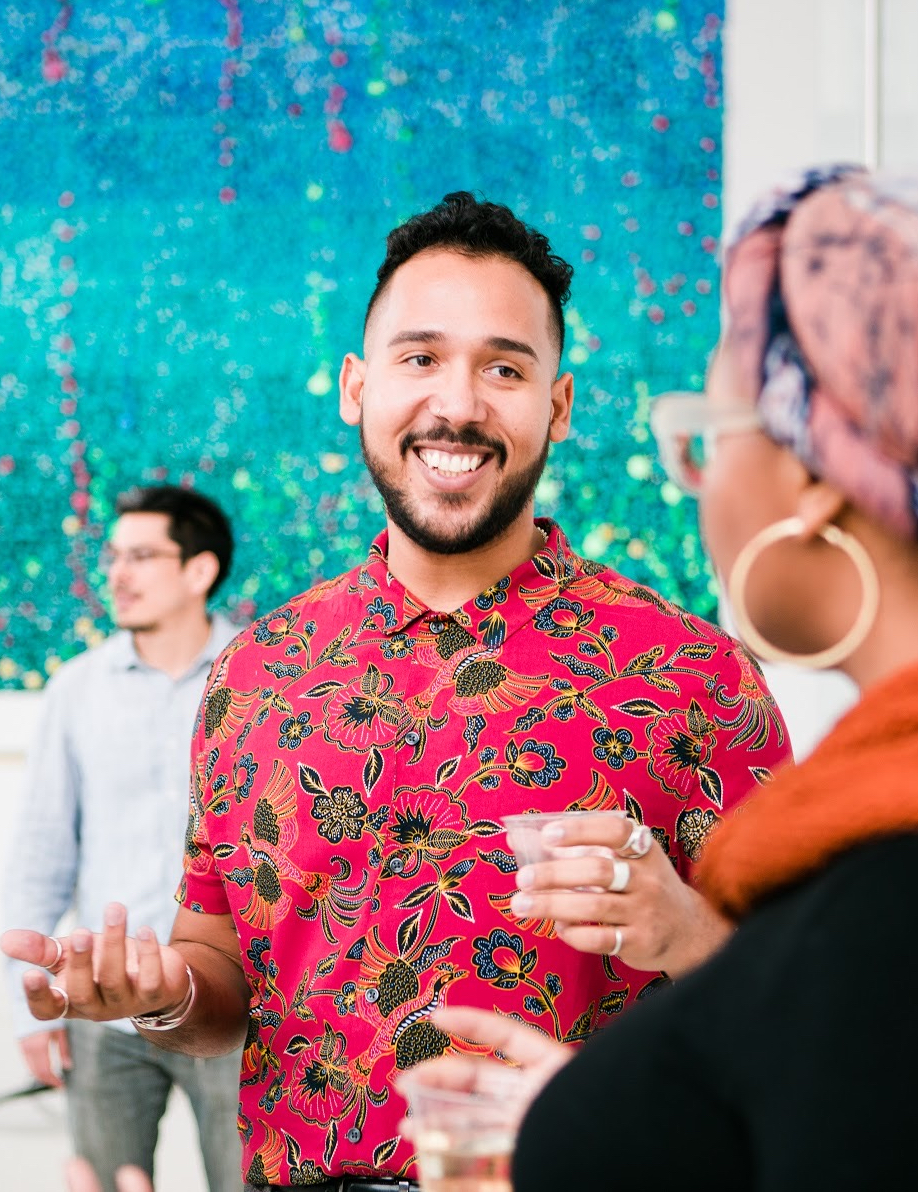Michael Rosario smiling at an event
